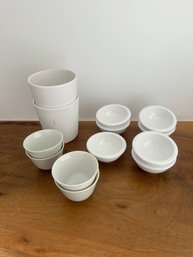 2 White Flower Pots And Variety Of Condiment Cups