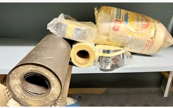 Garage Stuff: Insulation, Gutter Guards And A Roll Of Black Something