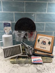 Kitchen Lot: Trivets, Ricer, Cheese Grater, Measurement, Mega Magnum, Easi Grip And More