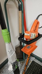 Collection Of Power And Manual Tools For Gardening: Hedge Trimmer, Pole Saw, Shovel, Weeding Implements