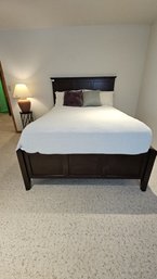 Beautiful Full Size Elevated Bed In Dark Wood With Six Large Drawers For Storage