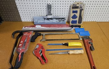 Collection Of Various Tools: Hack Saws, Hole Saws, Pry Bar, Crow Bar, PVC Tube Cutter, 14 Pipe Wrench, Etc.