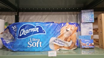 Shelf Of Five Boxes Of Kleenex And Package Of Charmin Toilet Tissue