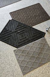 Collection Of Three Rubberized Door Mats In Grey, Black And Brown