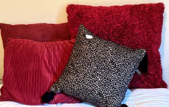 Set Of Four Pillows In Various Sizes And Colors