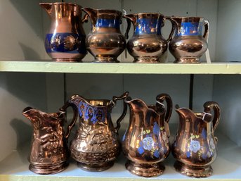 Large Lot Copper And Blue Lustre Pitchers