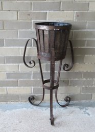 A Small Wrought Iron Custom Made Planter In 2 Parts, The Base And Basket Shaped Urn Which Is Missing The Plant