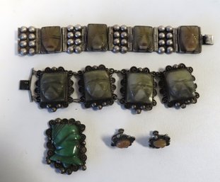 Four Pieces Of Mexican Silver Jewelry Decorated With Carved Green Onyx Aztec Figures. Includes 2 Bracelets, 1