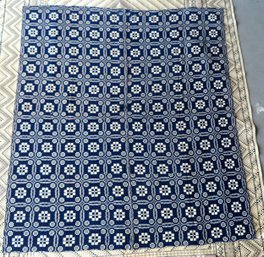 A Geometric Blue And White Woven Wool Coverlet With Center Seam, Early 19th Century. Measures 87 1/2' X 77'. W