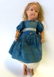 An Original Vintage Schoenhut Girl Doll, Glass Eyes, Carved Wood And Jointed Body Construction. Paint Loss To