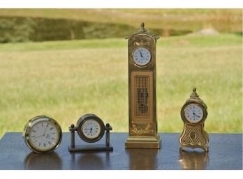 Four Small Table Top Clocks