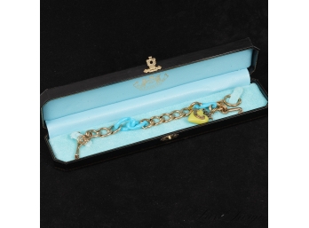 AUTHENTIC JUICY COUTURE GOLD METAL LINK BRACELET WITH BLUE AND GREEN LINKS AND CHARMS WITH ORIGINAL BOX