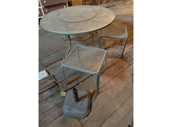 Patio Round Table With Two Small Tables And An Umbrella Base