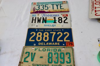 71.  4 Vintage License Plates