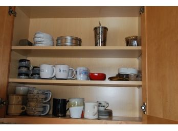 Kitchen Cabinet Filled With Mugs And Plates -140