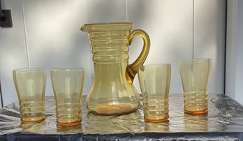 Tall Amber Glass Pitcher  And Four Tumblers