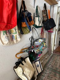 Wall Full Of Misc Bags Canvas Wheel Bag Small Totes Two Umbrellas