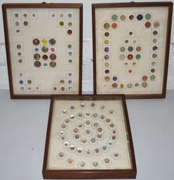 COLLECTION OF GLASS BUTTONS IN CASES MOUNTED ON CARDBOARD