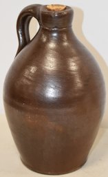 SM. 7 1/2' BROWN STONEWARE JUG