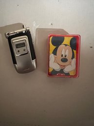 Mickey Mouse Playing Cards And Play Cell Phone