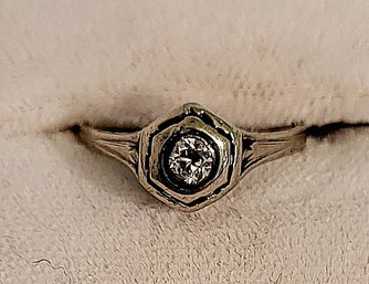 14K WHITE GOLD RING WITH APPROXIMATELY 0.08 POINT DIAMOND --SIZE 4