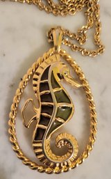 MARKED 'TRIFARI' GOLDTONE NECKLACE WITH LARGE TEAR DROP SHAPED PENDANT WITH SEA HORSE & GREEN STONES--30'