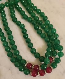 TRIPLE STRAND OF GREEN & RED BEADED NECKLACE--20'L WITH 9' DROP