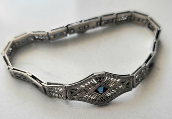 VINTAGE 'SIMMONS' MARKED STERLING BRACELET WITH   SAPPHIRE COLOR BLUE STONES--7 1/2'L