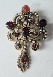 VINTAGE 'ART' GOLDTONE PIN WITH RED STONES & TINY SEED PEARLS