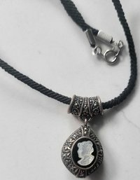 VINTAGE BLACK CORD NECKLACE WITH CAMEO PENDANT--17'L