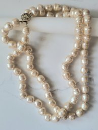 VINTAGE MARKED 14/20 BAROQUE PEARLS FROM A CHANEL HANDBAG INDIVIDUALLY KNOTTED DOUBLE STRAND NECKLACE