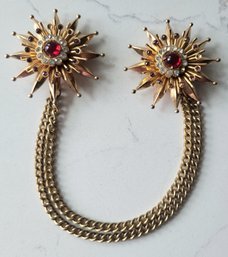 VINTAGE SIGNED 'CORO' GOLDTONE WITH RED CENTER& CLEAR & PURPLE RHINESTONES SWEATER CLIP