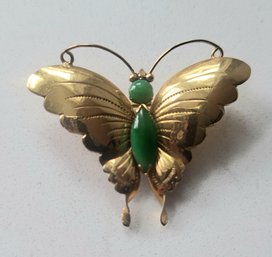 VINTAGE GOLDTONE BUTTERFLY BROOCH WITH THREE GREEN STONES