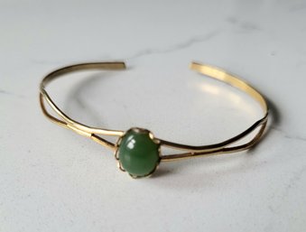 VINTAGE GOLDTONE BANGLE WITH GREEN STONE