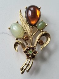 VINTAGE GOLDTONE FLORAL BROOCH WITH COLORED STONES & RHINESTONES