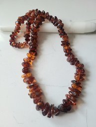 VINTAGE AMBER COLORED GRADUATED BEADED NECKLACE---28'L