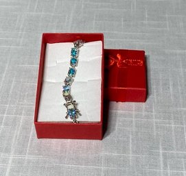 Blue Oval Gem And Silver Tone Bracelet - Red Box