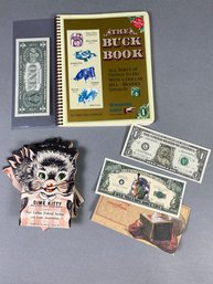 Fun Currency Related Lot Including A Santa Claus One Dollar Bill, A Million Dollar Bill, & The Buck Book