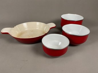 Red Enamelware Baking Dish And A Set Of Small Nested Mixing Bowls