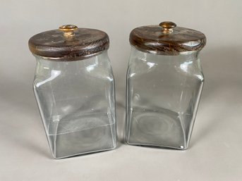 Two Large Square Glass Jars Or Cannisters With Wood Lids