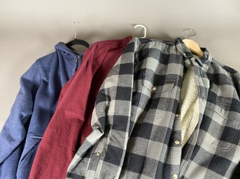 Two Lined Flannel And Fleece Shirts Or Jackets And A Dark Red Flannel Shirt