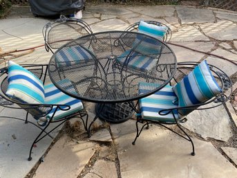 Nice Black Wrought Iron Patio Table, Four Chairs, Cushions And Umbrella Stand