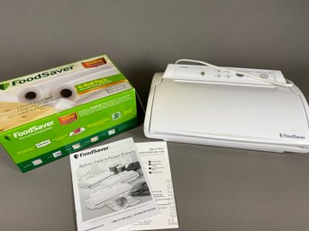 FoodSaver Vacuum Sealer And Several Rolls Of Vacuum Bags