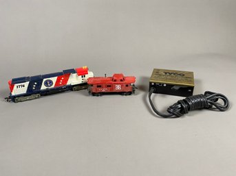 Tyco HO Scale Train 1776 Locomotive, Sante Fe Caboose, And A Model No. 899 T Hobby Transformer