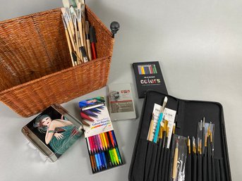 Basket Of Art Supplies Including Brushes, Watercolor Pencils, Faber Castell Big Brush Pens, Graphite Pencils