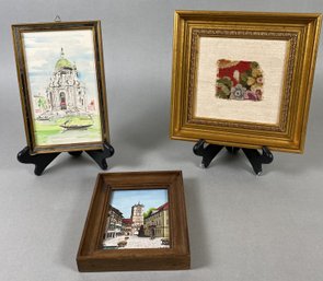 Two Small Pieces Of Framed Art, One Features St. Charles Cathedral & A Framed Piece Of Cloth