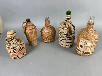 Set Of 5 Vintage Demijohn Woven Rattan Wicker Covered Wine Or Whiskey Bottles Or Jugs With Handles