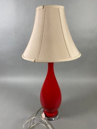 Beautiful Red Glass Table Lamp With Clear Base & Round Tan Shade