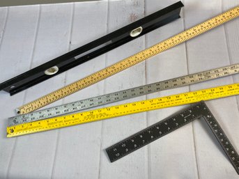 Two Metal And One Wood Yard Stick (36'), A Metal Square And A Two-foot Stanley Level