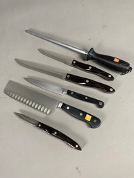 Several Knives By A Variety Of Maker Including Faberware, Cutco, Wusthof And Knife Sharpener